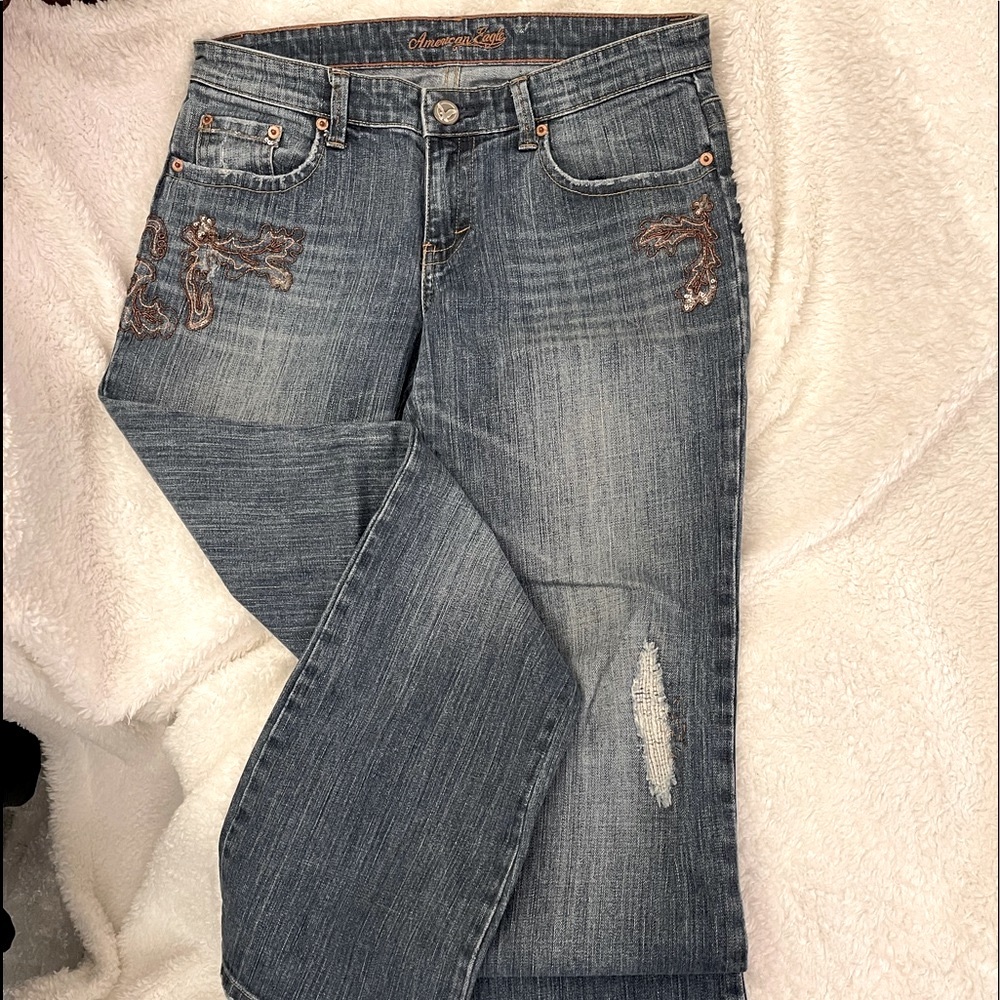 American Eagle stretch boot cut jeans with embroidered and beaded details.